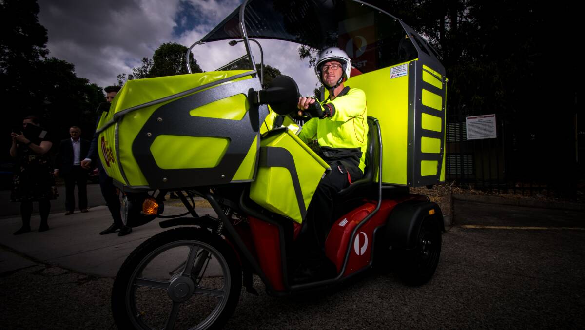 New gear: Long-time postie Steven Richards with one of the electric vehicles in October, 2017, when the trial began.