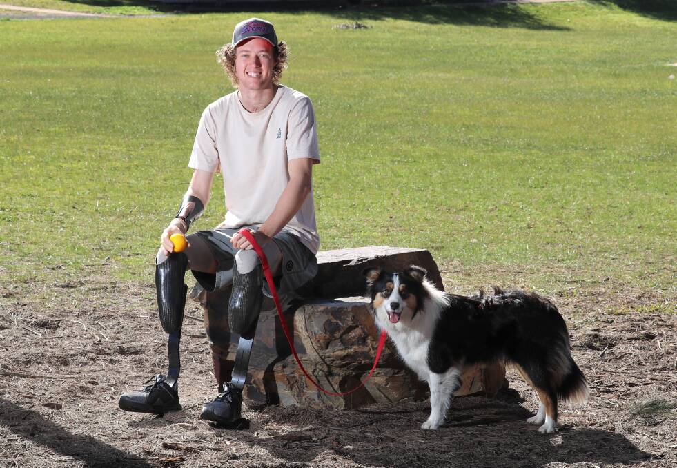 LOOKING AHEAD: Josh Hanlon with Lulu, the border collie who came into his life not long after he came out of hospital last year. Picture: Les Smith