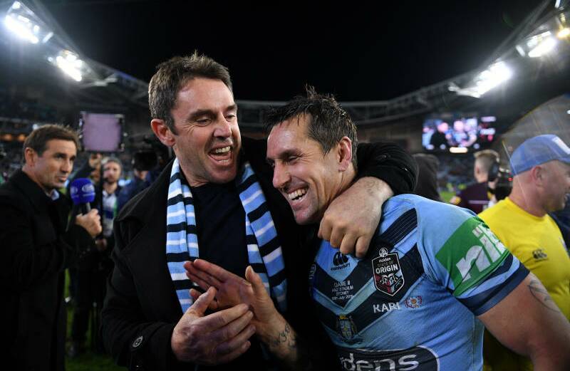 Turning the tables: NSW coach Brad Fittler congratulates Mitchell Pearce after the Blues series-deciding win in Sydney.