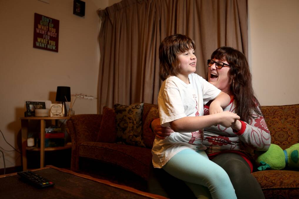 DAILY CHALLENGES: Elizabeth Noone says the stress of trying to navigate the NDIS for her daughter Jasmine has affected her own health. "It disables me to look after her the way that I need to," she says. Picture: JAMES WILTSHIRE
